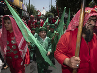 Iraqi men and children living in Iran are performing in a religious festival to commemorate Ashura in the Dolatabad neighborhood in southern...