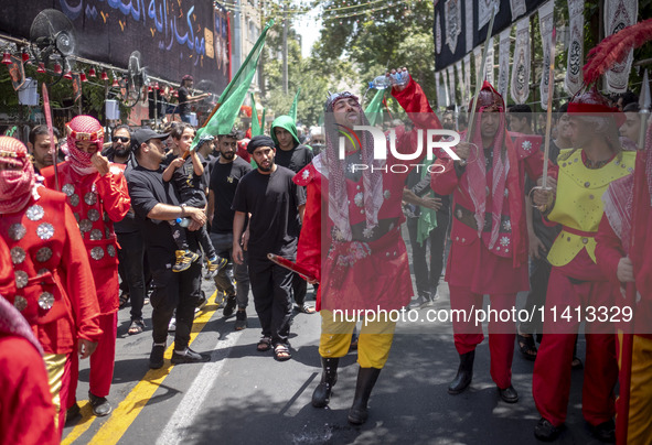 Iraqi men living in Iran are performing in a religious festival to commemorate Ashura in the Dolatabad neighborhood in southern Tehran, Iran...