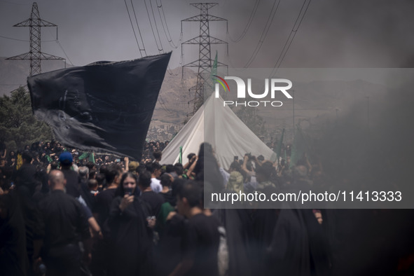 A tent that is set up in an area, serving as a symbol of the tent of Imam Hussein, is being pictured during a religious festival to commemor...