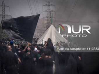 A tent that is set up in an area, serving as a symbol of the tent of Imam Hussein, is being pictured during a religious festival to commemor...