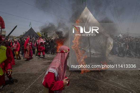 An Iraqi man living in Iran is performing in a religious festival to commemorate Ashura in the Dolatabad neighborhood in southern Tehran, Ir...