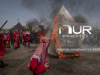 An Iraqi man living in Iran is performing in a religious festival to commemorate Ashura in the Dolatabad neighborhood in southern Tehran, Ir...