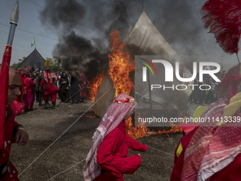 Iraqi men living in Iran are performing in a religious festival to commemorate Ashura in the Dolatabad neighborhood in southern Tehran, Iran...