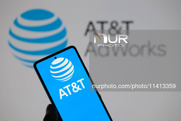 The AT&T logo is being displayed on a smartphone with AT&T visible in the background in this photo illustration in Brussels, Belgium, on Jul...