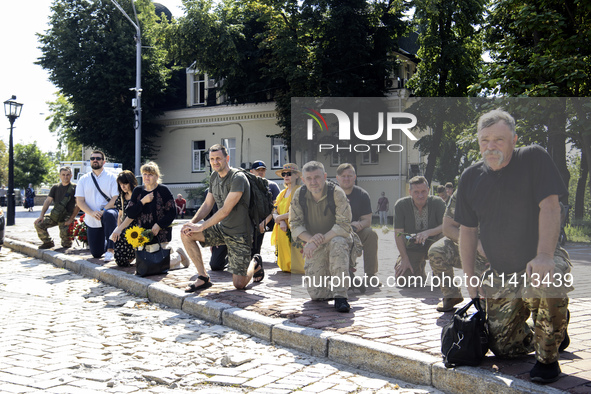 People are attending a funeral service for Mykola Kokhanivskyi, commander of the OUN (Organisation of Ukrainian Nationalists) volunteer batt...