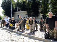 People are attending a funeral service for Mykola Kokhanivskyi, commander of the OUN (Organisation of Ukrainian Nationalists) volunteer batt...