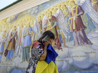 People are attending a funeral service for Mykola Kokhanivskyi, commander of the OUN (Organisation of Ukrainian Nationalists) volunteer batt...