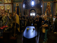 People are attending a funeral service for Mykola Kokhanivskyi, commander of the OUN (Organisation of Ukrainian Nationalists) volunteer batt...