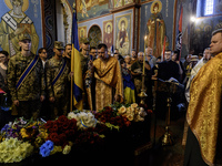 People are attending a funeral service for Mykola Kokhanivskyi, commander of the OUN (Organisation of Ukrainian Nationalists) volunteer batt...