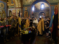 People are attending a funeral service for Mykola Kokhanivskyi, commander of the OUN (Organisation of Ukrainian Nationalists) volunteer batt...