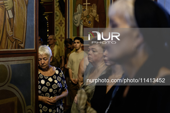 People are attending a funeral service for Mykola Kokhanivskyi, commander of the OUN (Organisation of Ukrainian Nationalists) volunteer batt...