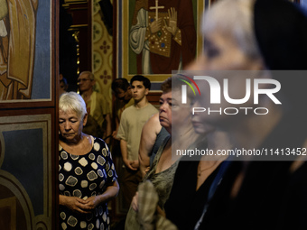 People are attending a funeral service for Mykola Kokhanivskyi, commander of the OUN (Organisation of Ukrainian Nationalists) volunteer batt...