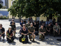 People are attending a funeral service for Mykola Kokhanivskyi, commander of the OUN (Organisation of Ukrainian Nationalists) volunteer batt...