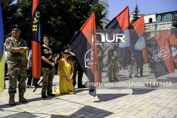 People are attending a funeral service for Mykola Kokhanivskyi, commander of the OUN (Organisation of Ukrainian Nationalists) volunteer batt...