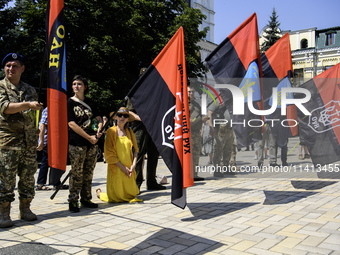 People are attending a funeral service for Mykola Kokhanivskyi, commander of the OUN (Organisation of Ukrainian Nationalists) volunteer batt...