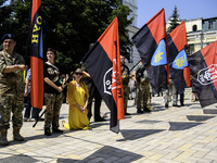 People are attending a funeral service for Mykola Kokhanivskyi, commander of the OUN (Organisation of Ukrainian Nationalists) volunteer batt...