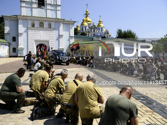 People are attending a funeral service for Mykola Kokhanivskyi, commander of the OUN (Organisation of Ukrainian Nationalists) volunteer batt...