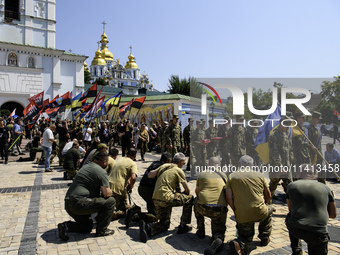 People are attending a funeral service for Mykola Kokhanivskyi, commander of the OUN (Organisation of Ukrainian Nationalists) volunteer batt...