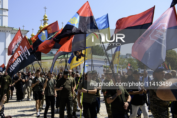 People are attending a funeral service for Mykola Kokhanivskyi, commander of the OUN (Organisation of Ukrainian Nationalists) volunteer batt...