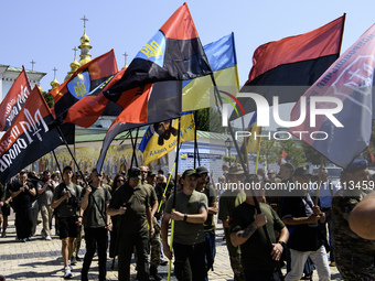 People are attending a funeral service for Mykola Kokhanivskyi, commander of the OUN (Organisation of Ukrainian Nationalists) volunteer batt...