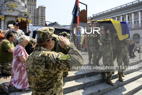 Servicemen are carrying the coffin of Mykola Kokhanivskyi, commander of the OUN (Organisation of Ukrainian Nationalists) volunteer battalion...