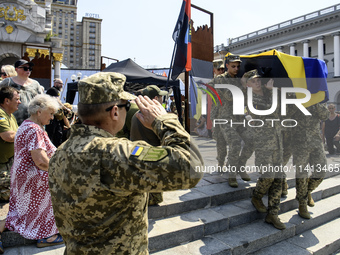 Servicemen are carrying the coffin of Mykola Kokhanivskyi, commander of the OUN (Organisation of Ukrainian Nationalists) volunteer battalion...