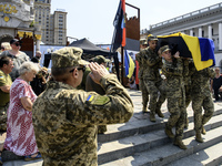 Servicemen are carrying the coffin of Mykola Kokhanivskyi, commander of the OUN (Organisation of Ukrainian Nationalists) volunteer battalion...