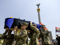 Servicemen are carrying the coffin of Mykola Kokhanivskyi, commander of the OUN (Organisation of Ukrainian Nationalists) volunteer battalion...