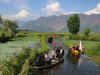 Kashmiri Shiite Muslim mourners are participating in a Muharram procession on boats on the ninth day of Ashura in the interiors of Dal Lake...