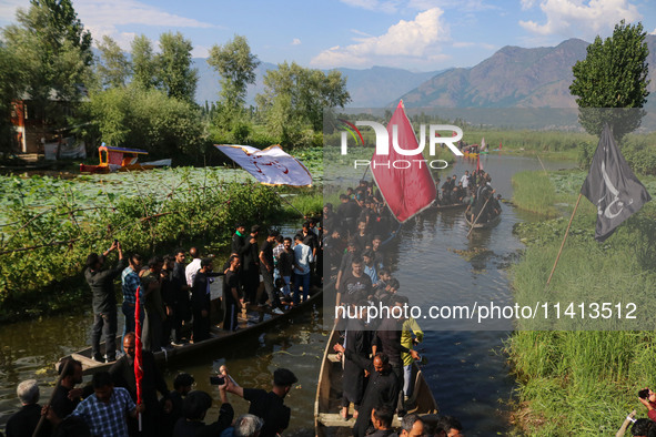 Kashmiri Shiite Muslim mourners are participating in a Muharram procession on boats on the ninth day of Ashura in the interiors of Dal Lake...