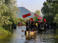 Kashmiri Shiite Muslim mourners are participating in a Muharram procession on boats on the ninth day of Ashura in the interiors of Dal Lake...