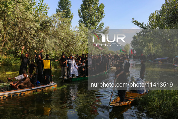 Kashmiri Shiite Muslim mourners are participating in a Muharram procession on boats on the ninth day of Ashura in the interiors of Dal Lake...