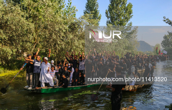 Kashmiri Shiite Muslim mourners are participating in a Muharram procession on boats on the ninth day of Ashura in the interiors of Dal Lake...