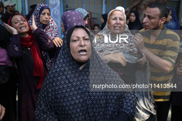 Palestinians are reacting following an Israeli strike on a UN school sheltering displaced people, amid the Israel-Hamas conflict, in Nuseira...