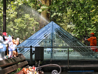 A municipal worker is washing glass domes over the archaeological excavations of a Greek settlement on Prymorskyi Boulevard in Odesa, Ukrain...