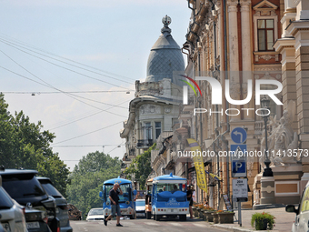 Two electric sightseeing buses are parking in the street in Odesa, Ukraine, on July 13, 2024. NO USE RUSSIA. NO USE BELARUS. (