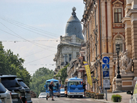 Two electric sightseeing buses are parking in the street in Odesa, Ukraine, on July 13, 2024. NO USE RUSSIA. NO USE BELARUS. (