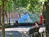 A municipal worker is washing glass domes over the archaeological excavations of a Greek settlement on Prymorskyi Boulevard in Odesa, Ukrain...