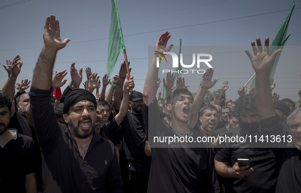 Iraqi men living in Iran are beating themselves while participating in a religious festival to commemorate Ashura in the Dolatabad neighborh...