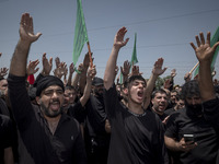 Iraqi men living in Iran are beating themselves while participating in a religious festival to commemorate Ashura in the Dolatabad neighborh...