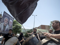 Iraqi men living in Iran are playing traditional musical instruments while participating in a religious festival to commemorate Ashura in th...