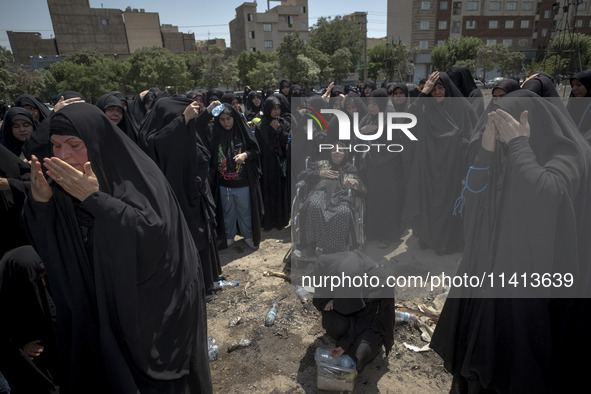 Iraqi women living in Iran are beating themselves while participating in a religious festival to commemorate Ashura, in Dolatabad neighborho...