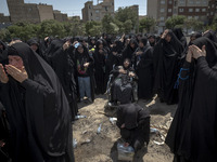 Iraqi women living in Iran are beating themselves while participating in a religious festival to commemorate Ashura, in Dolatabad neighborho...