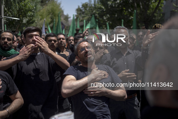 Iraqi men living in Iran are beating themselves while participating in a religious festival to commemorate Ashura in the Dolatabad neighborh...