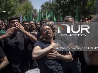 Iraqi men living in Iran are beating themselves while participating in a religious festival to commemorate Ashura in the Dolatabad neighborh...