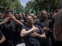 Iraqi men living in Iran are beating themselves while participating in a religious festival to commemorate Ashura in the Dolatabad neighborh...