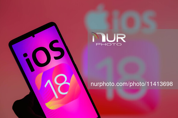 The Apple iOS 18 is being displayed on a smartphone with Apple iOS 18 visible in the background, in this photo illustration in Brussels, Bel...