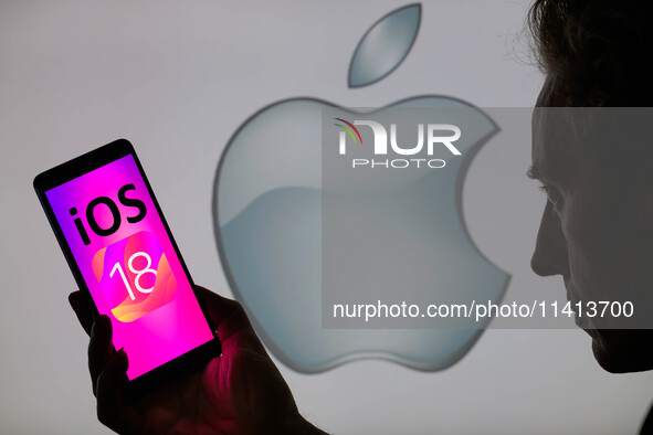 The Apple iOS 18 is being displayed on a smartphone with the Apple icon visible in the background, in this photo illustration in Brussels, B...