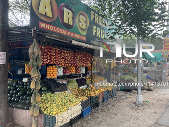 A fruit stand is operating in Punalur, Kerala, India, on April 04, 2024. (