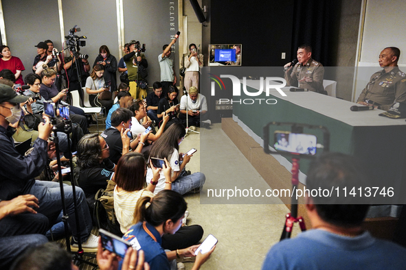 Metropolitan Police Bureau Commissioner Thiti Sangsawang is speaking as National Police Chief Torsak Sukvimol is looking on during a press c...